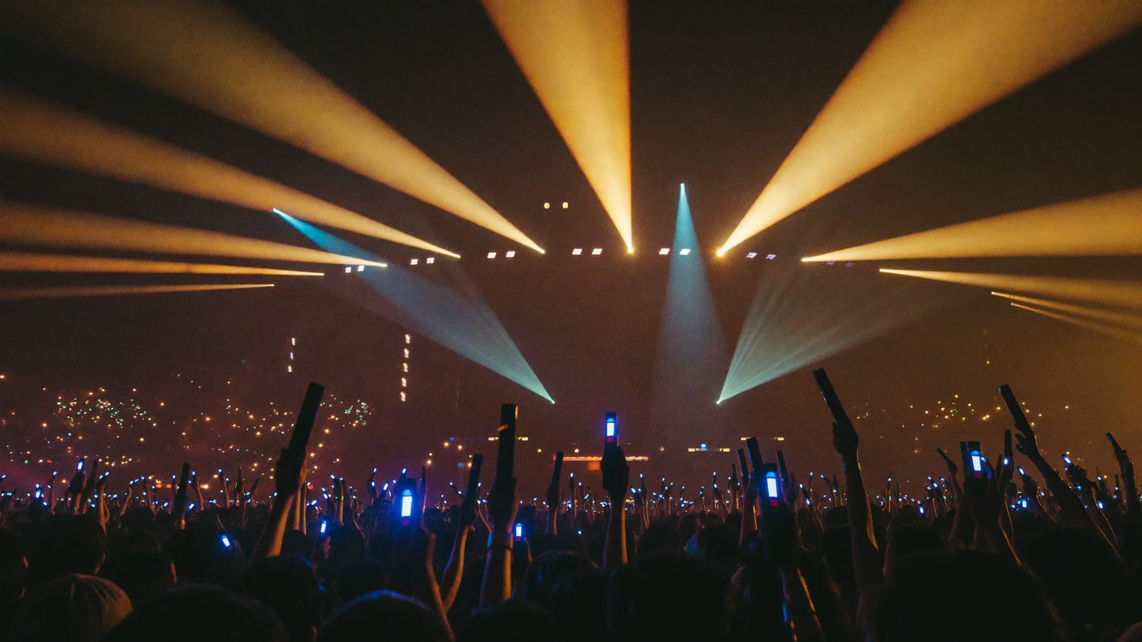 A stadium concert crowd under bright stage lights, illustrating the 2026 TIMA International Music Awards at Kai Tak Stadium